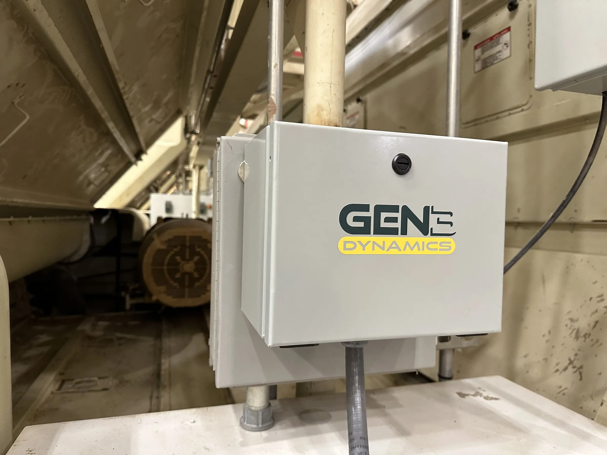 A Gen 3 Dynamics enclosure mounted beside a gin stand