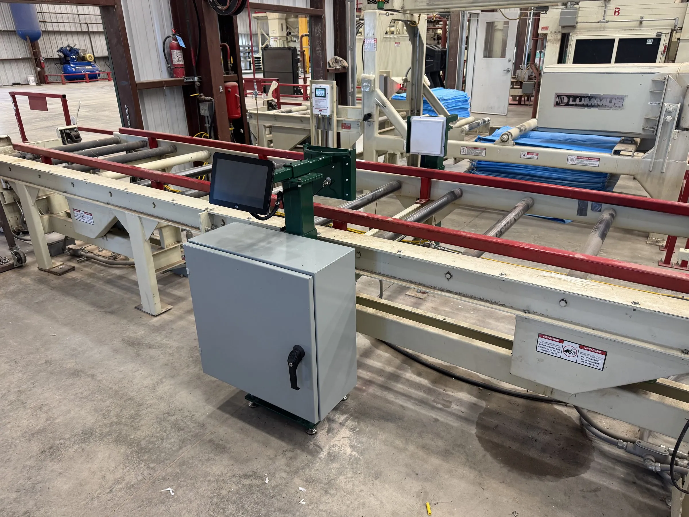 An MS-1 enclosure, sensor head and touchscreen installed alongside a bale conveyor