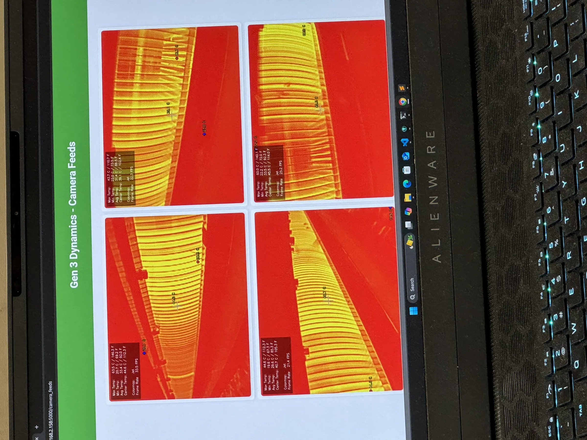 Four live thermal camera feeds displayed side by side, each showing the saw cylinder of a gin stand